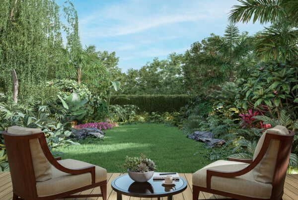 Two Duis Hendrerit chairs and a table with a cup and book sit on a wooden deck, overlooking a lush garden with various plants under a clear sky.