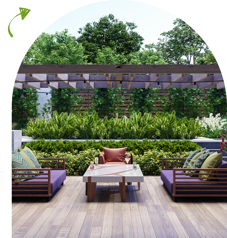 Outdoor patio with wooden furniture, including two sofas with colorful cushions and a table. Pergola above with green foliage in the background.